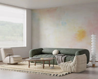 Soft pink and yellow tones of the Gentle Pastel Wash Wall Mural brighten a living area.