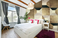 A velvet sofa is visible in front of the mural.

