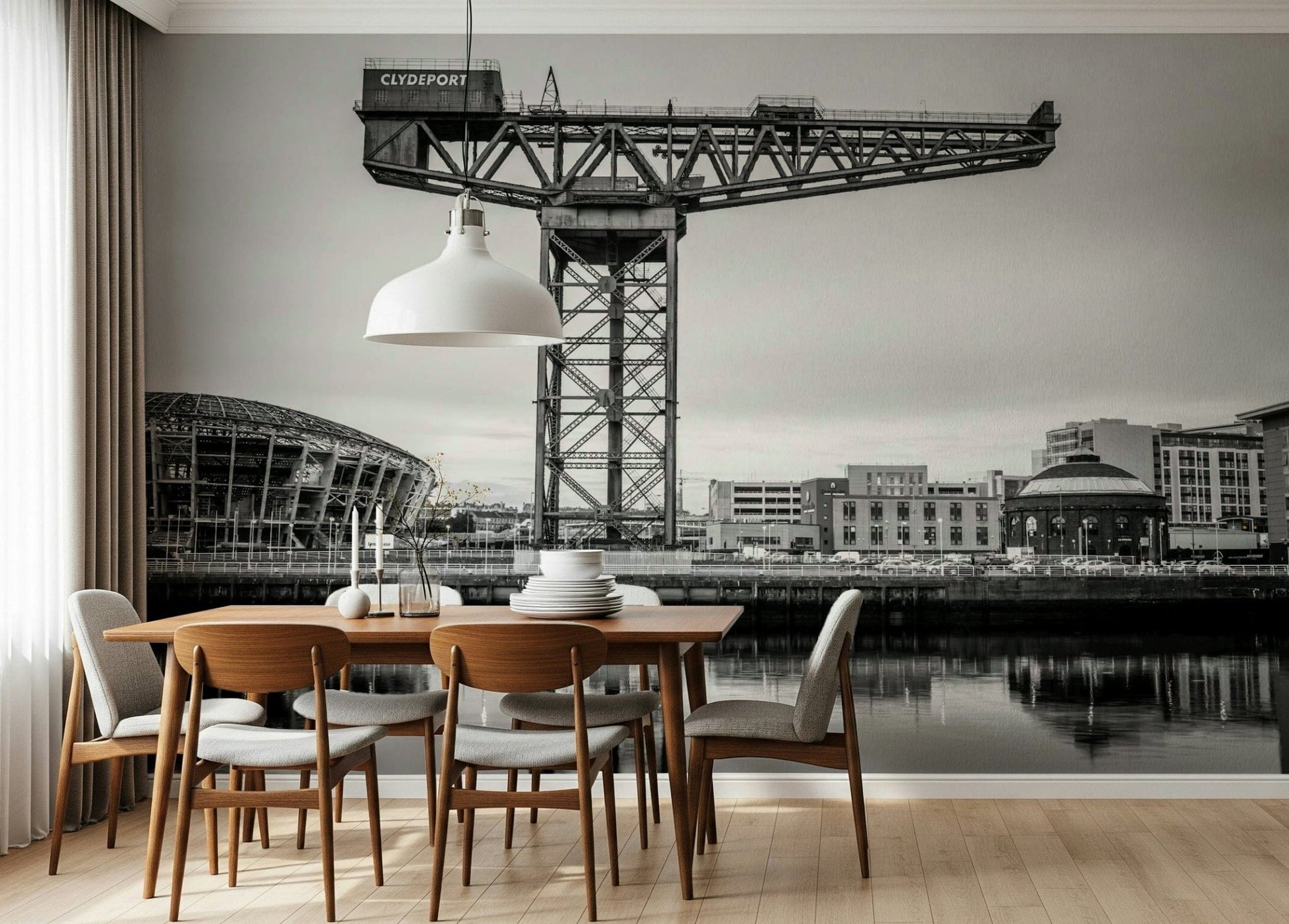 Industrial city landscape mural in a modern living room with grey furniture.