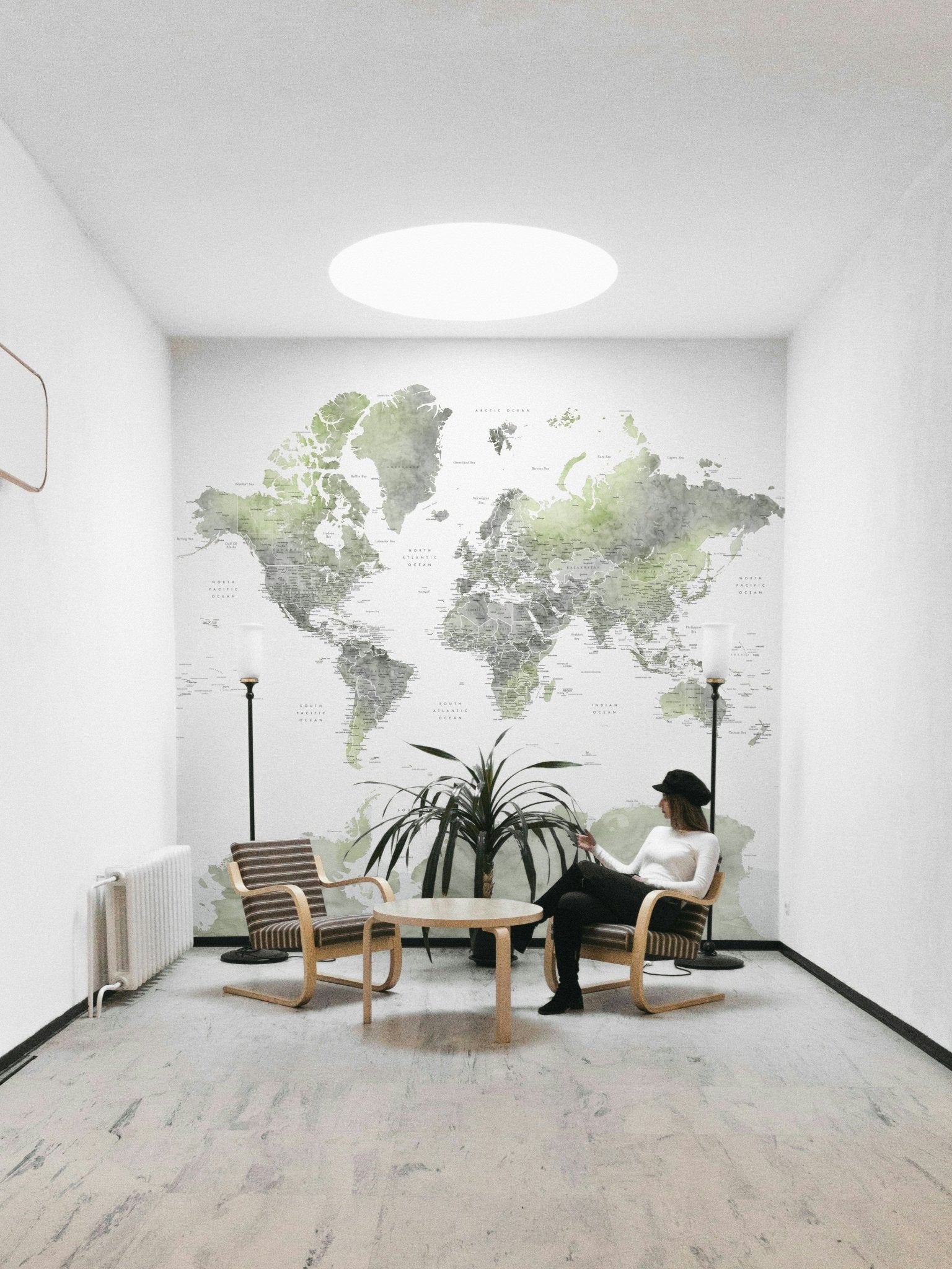 Green world map watercolor mural

