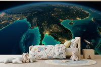 Satellite view of Earth at night wallpaper for a wall mural.