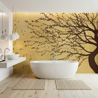 Golden Bloom Breeze wall mural in a bright sunroom with wicker furniture.