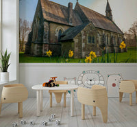 Historical stone structure and vibrant Golden Daffodils wall design.