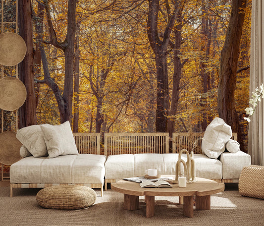 Boho living room with Golden Forest Scene Wall Mural behind a cream sofa