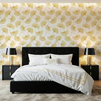 Shimmering gold ginkgo branch wallpaper mural for a nursery wall space.