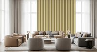 Lounge seating and poufs sit against Golden Grid Stripes Wallpaper in soft gold