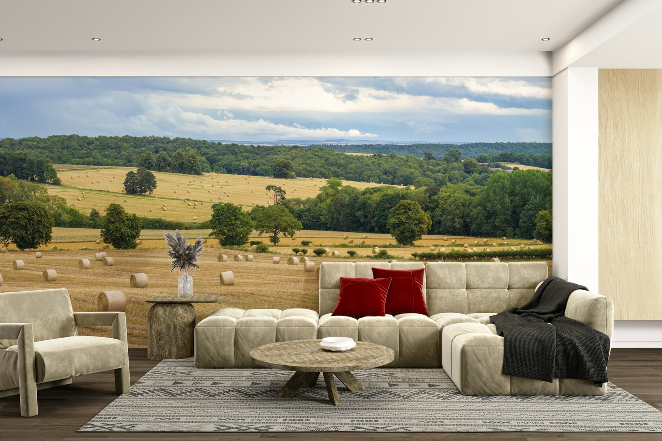 A wall mural of a panoramic harvest field.


