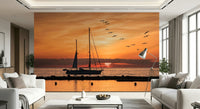 Golden Horizon sailboat silhouette against amber evening sky mural.