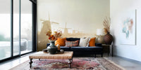 A peaceful Dutch landscape mural on decorative wallpaper.