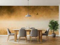 A beautiful bird flight wallpaper mural bathed in golden hour light.