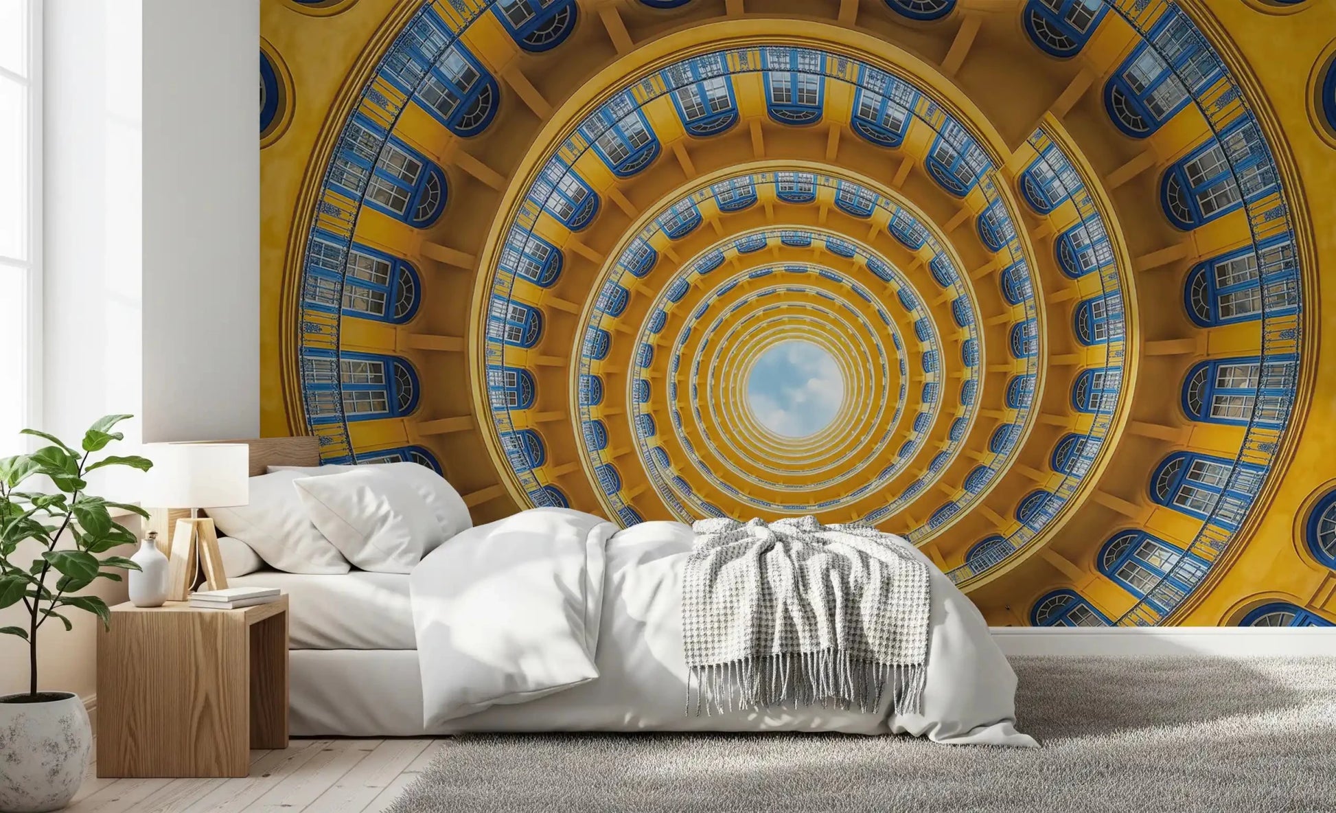 Bold blue window detail meets warm gold tones on a spiral perspective wall mural.GD9533