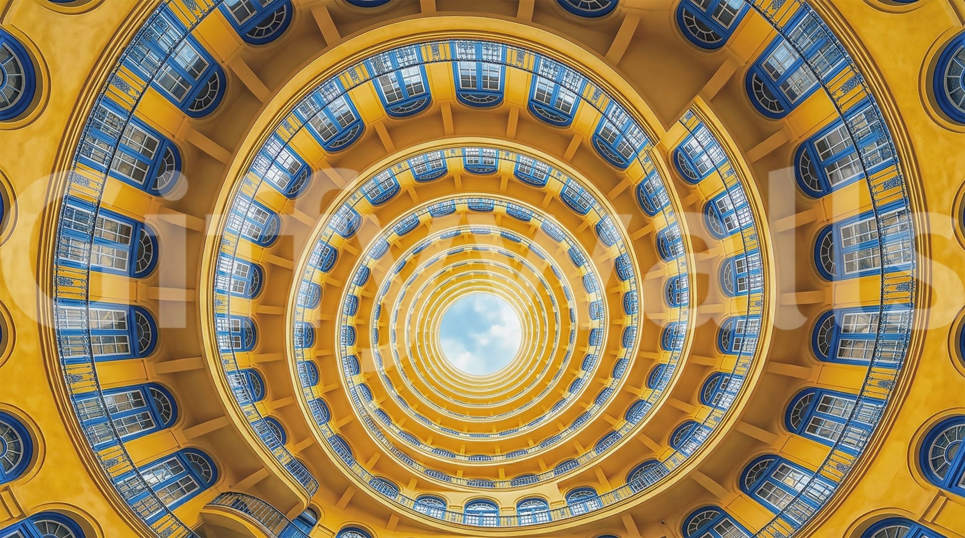 Soft cloud detail fills the round opening at the heart of this spiral wall mural .GD9533