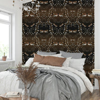 Nature-meets-gothic wall design with insects and tangled flora.

