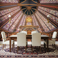 Dining room styled with radiant Gothic wall mural beneath arched lines and warm gold