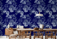 Midnight floral wallpaper with soft blue blossoms and engraved botanical detailing