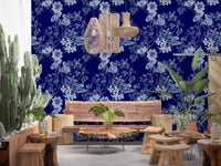 Deep blue wallpaper with pale flower outlines and vintage botanical character