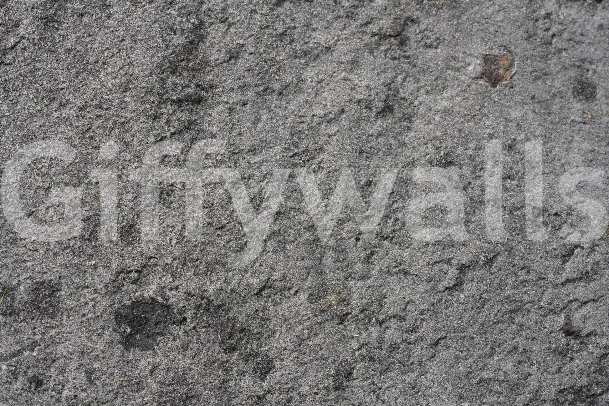 Corner view of gray peel and stick feature wall.