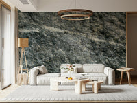 Granite grey wallpaper mural behind a minimalist sofa.