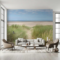 This airy living room uses Grassland by the Sea Wall Mural for a soft coastal backdrop