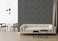 Moody gray forest scene on Scandinavian Folk Bird Wallpaper accent wall.