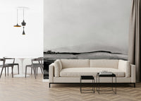 Monochrome Grayscale Hills mural behind a modern sofa.