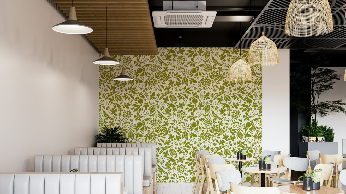 A bedroom decorated with a green flower mural

