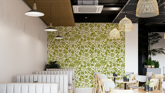 A bedroom decorated with a green flower mural

