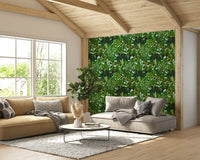 Wall mural with green palm leaves.
