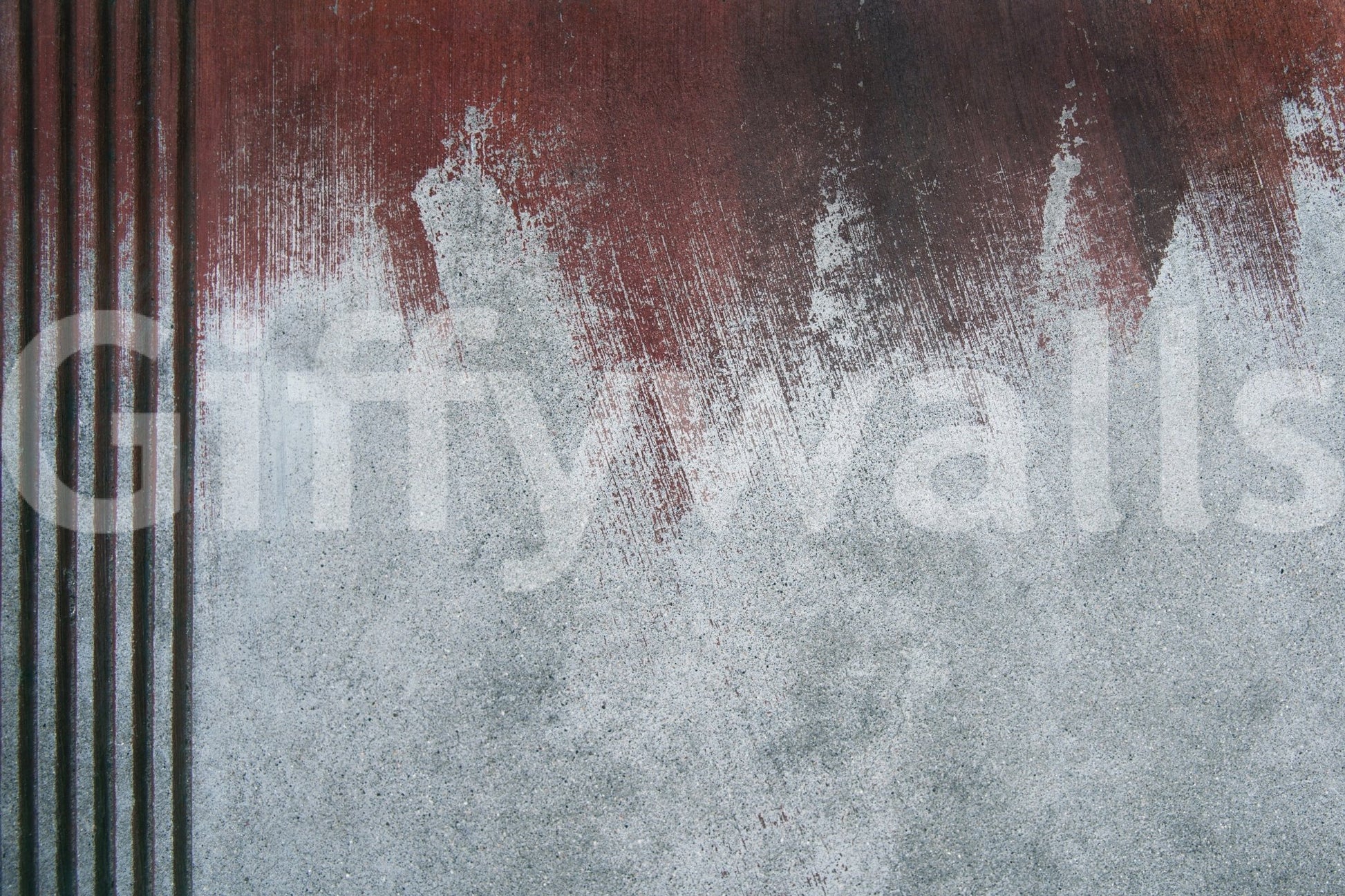 Artistic texture of the Gritty Fade peel and stick mural behind modern furniture.