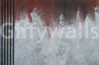 Artistic texture of the Gritty Fade peel and stick mural behind modern furniture.
