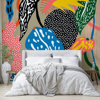 Colorful jungle leaves in bold wall mural

