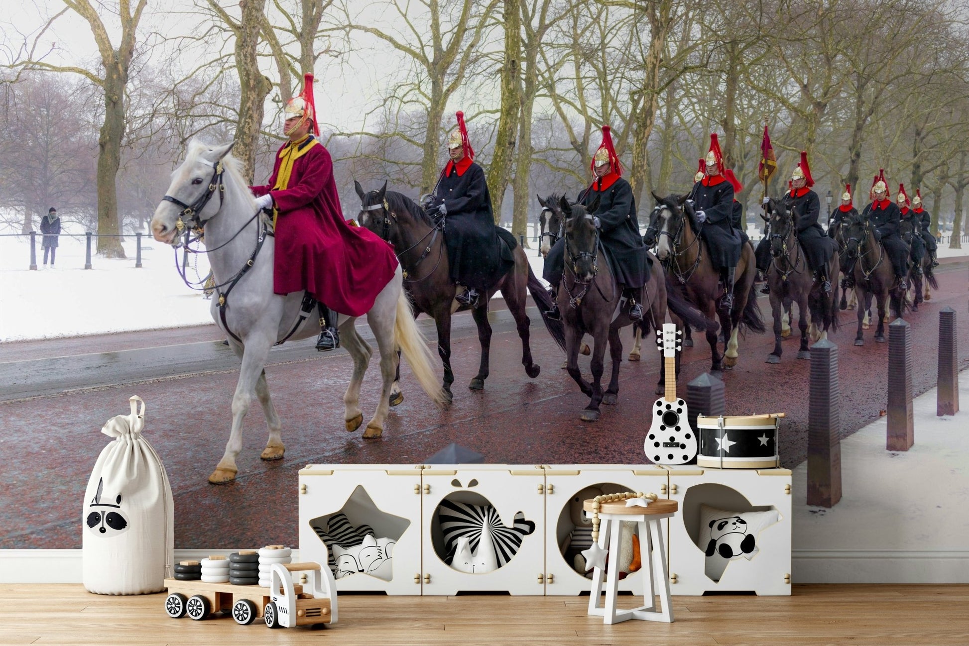 A bedroom with the London mural behind the headboard.

