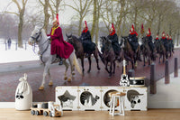 A bedroom with the London mural behind the headboard.


