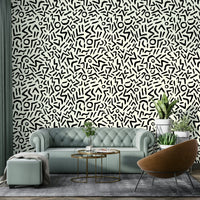 An angled shot of a wall with tribal wallpaper

