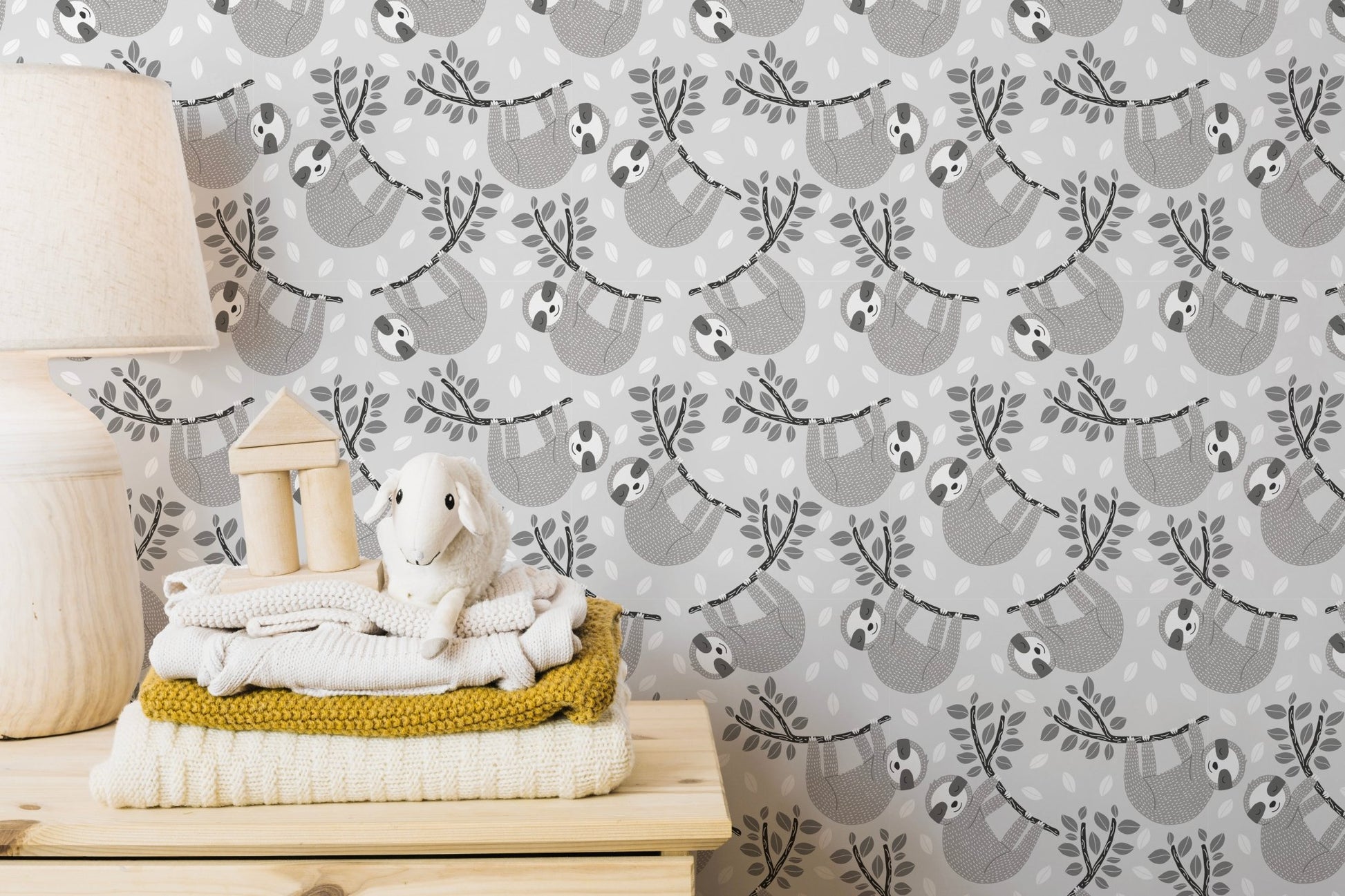 Sloths on leafy branches wallpaper design
