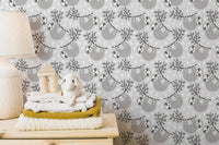 Sloths on leafy branches wallpaper design