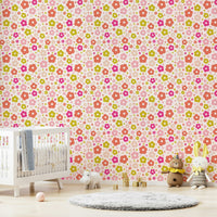 Vibrant flower mural with happy daisy faces

