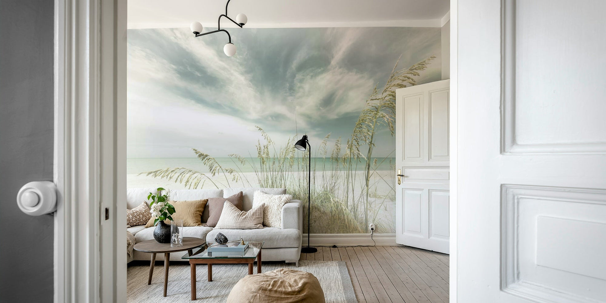 Coastal mural featuring a vintage-style oceanfront scene.


