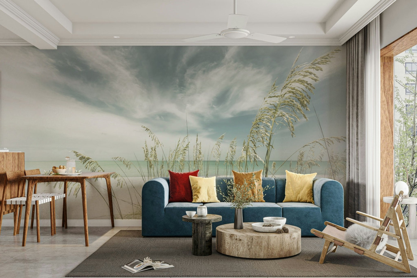 Vintage mural of a tranquil beach with soft ocean waves.

