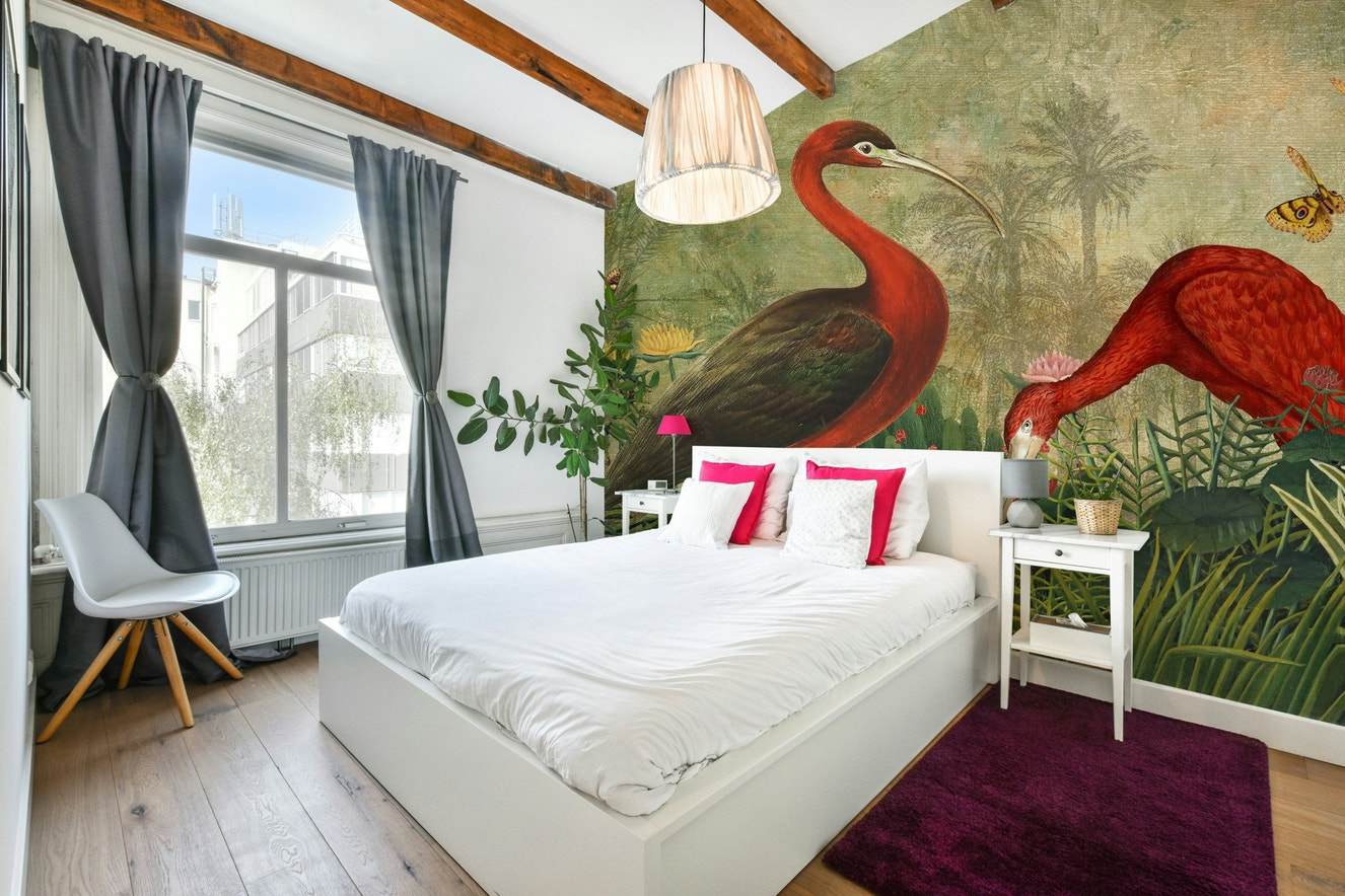 Hidden Oasis Wall Mural with tropical foliage.

