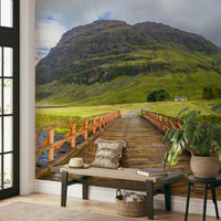 Serene countryside mural with old bridge


