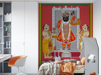 The background is adorned with intricate, traditional patterns.
