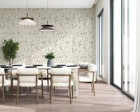 Daylight brightens the dining nook against the gentle pattern of Homeland Floral Muted Wallpaper