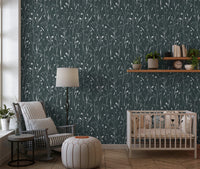Nursery corner framed by Homeland Floral Outer Space Wallpaper and crib