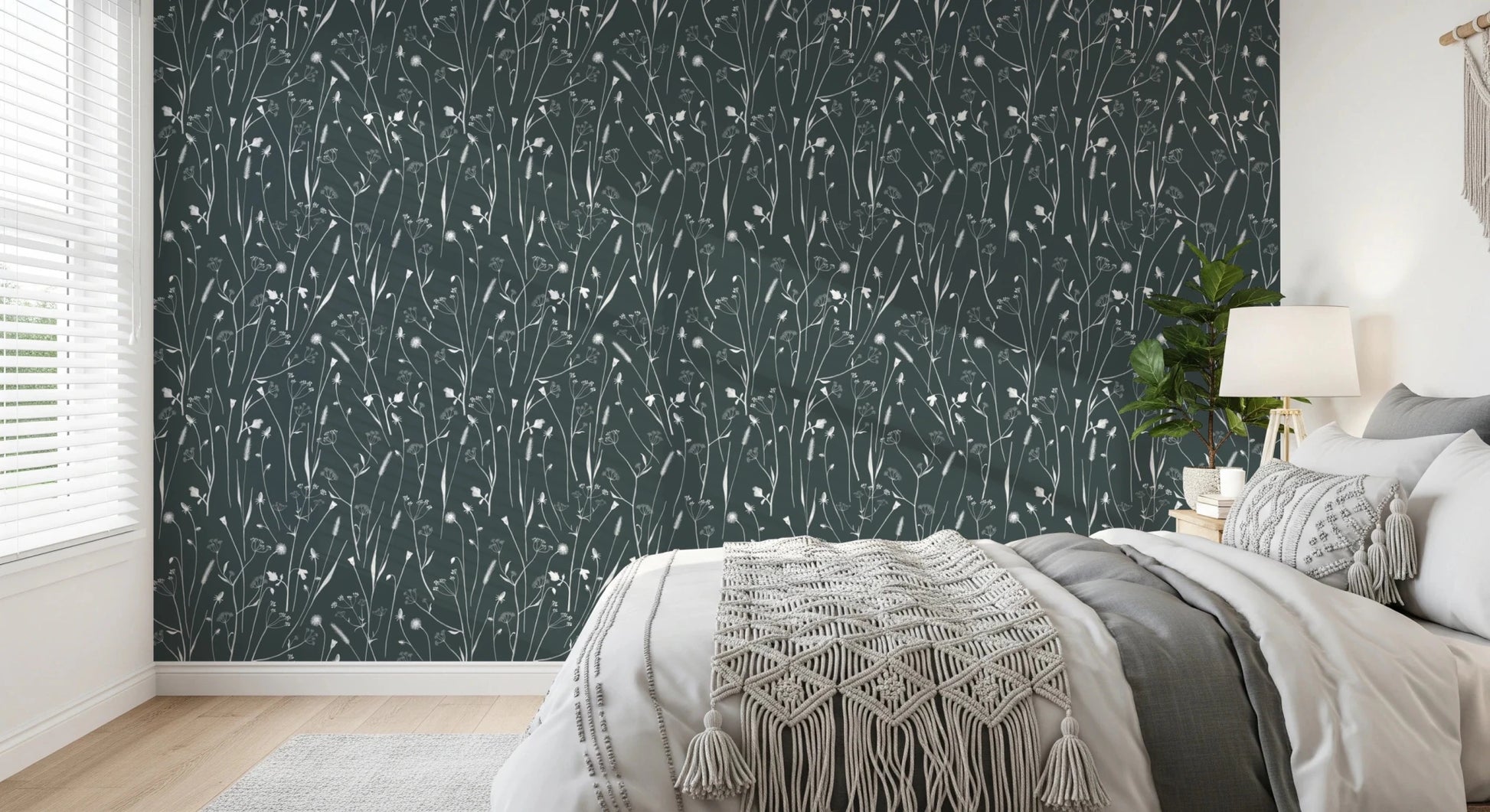 Bedroom nook softened by Homeland Floral Outer Space Wallpaper and pale decor