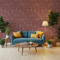 Living room with Homeland Floral Terracotta Wallpaper behind a blue sofa
