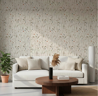Homeland Floral Winter Wallpaper adds a soft botanical backdrop to this cozy living room
