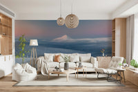 A peaceful mountain range mural on decorative wallpaper.