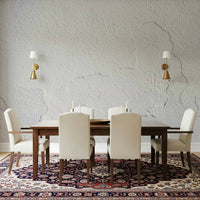 Detailed view of the faux peeling paint effect on the white peel and stick wallpaper.