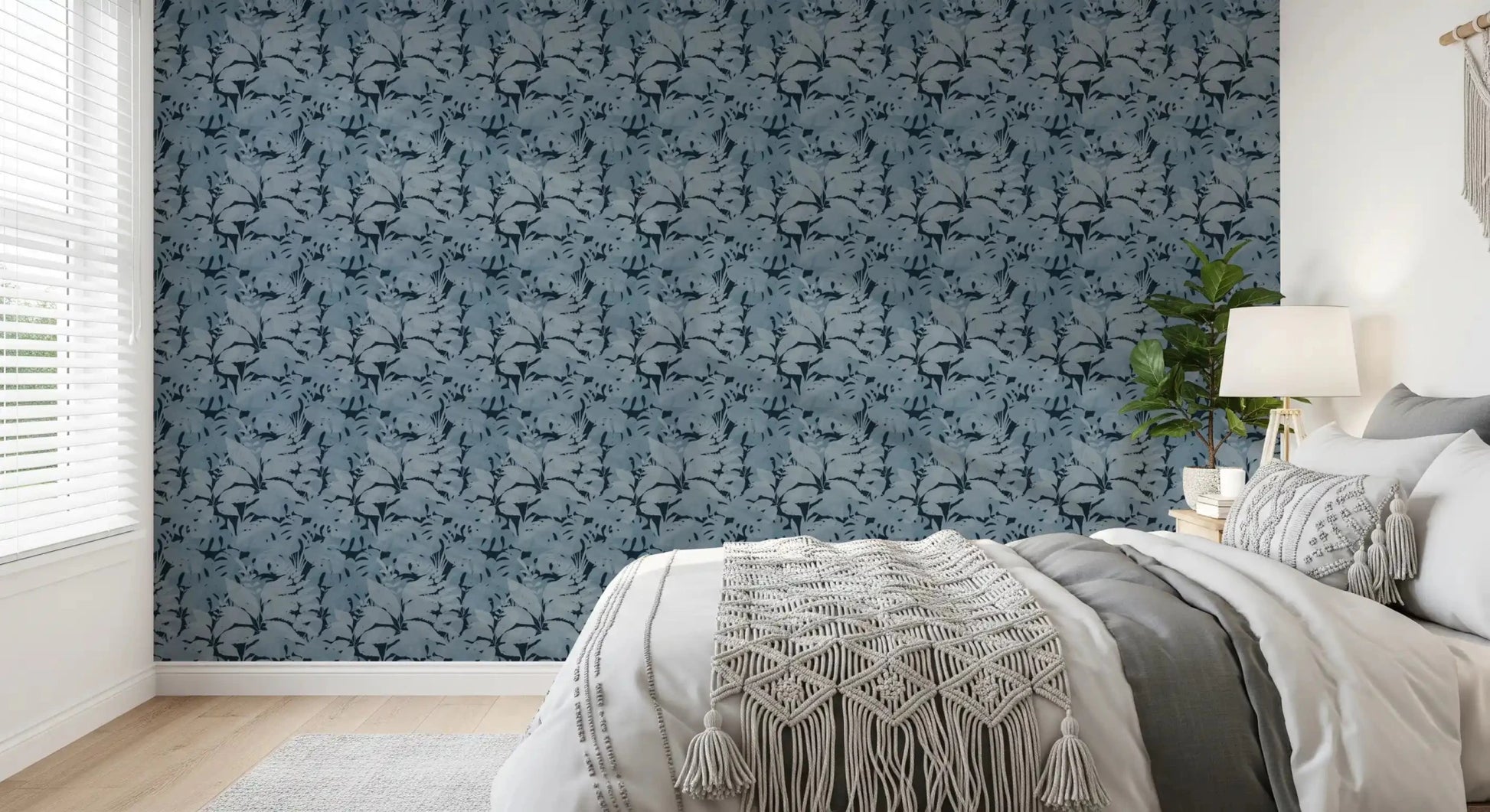 Moody bedroom featuring Indigo Botanical Monstera Leaves Wallpaper